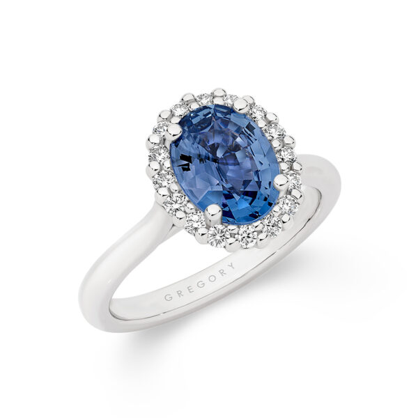 Oval Blue Sapphire and Diamond Halo Ring in 18K White Gold E1044